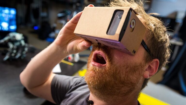 Image of Man experiencing a VR product demo using a cardboard VR headset