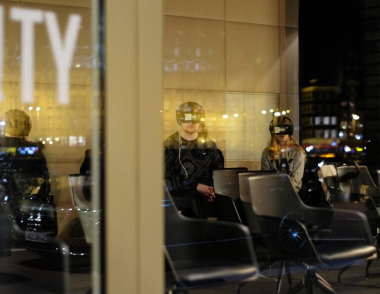 Image of People experiencing a VR product demo in a modern indoor setting