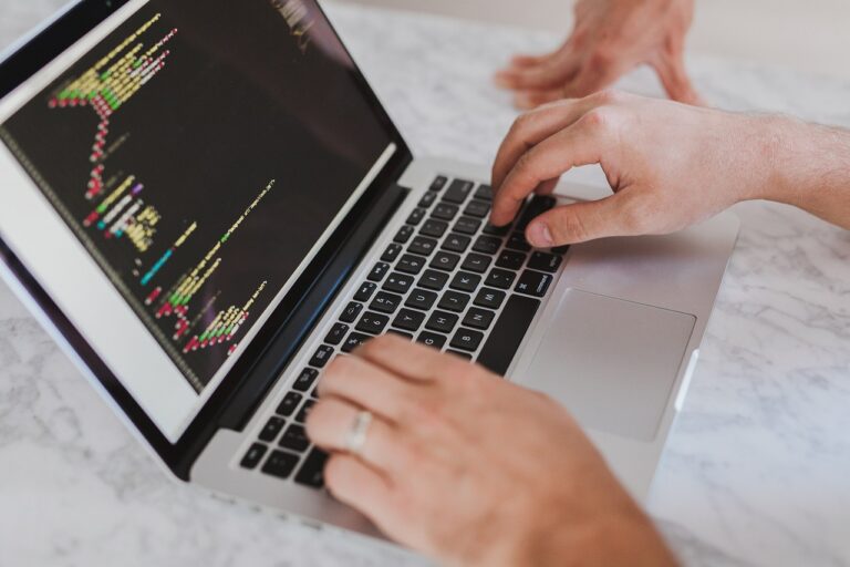 Image of man writing code