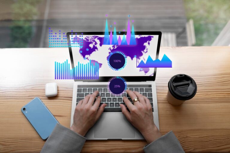 Person typing on laptop with data analytics visuals on screen